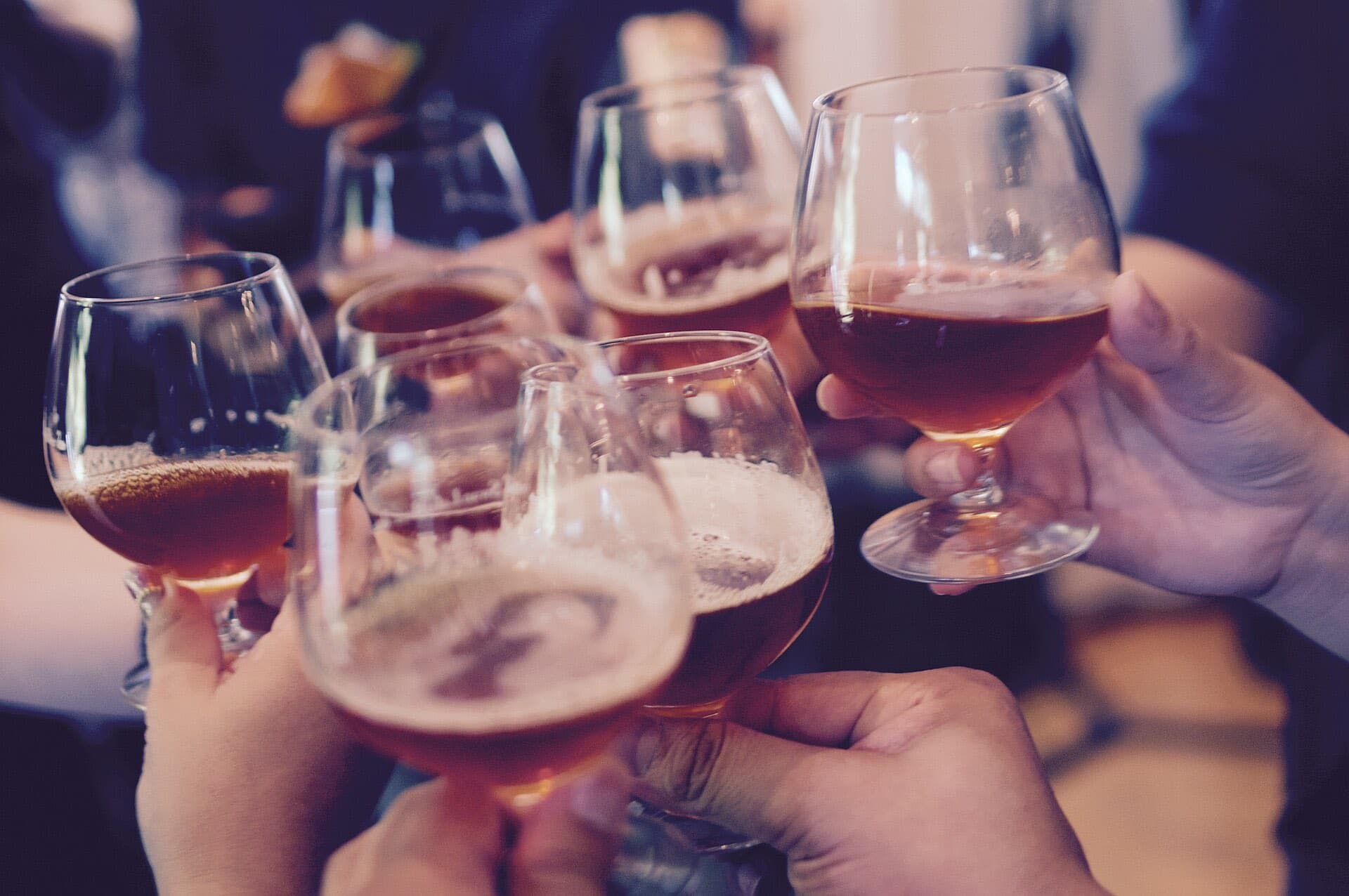 Guests raising glasses together in a toast